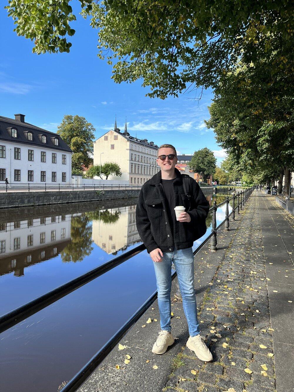 Enda Harte standing by a river in Uppsala, Sweden. Opens his LinkedIn profile